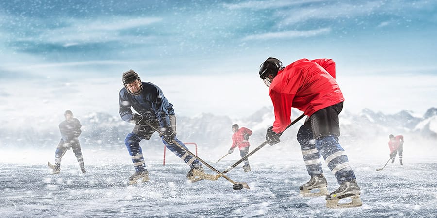 hockey players outside on the ice